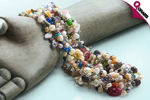 From QR89 Add a Unique Touch to Your Outfits with a Single OR Triple Strand Freshwater Pearl Charm Necklace! (Up to QR1540 Value)